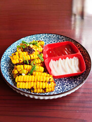 Japanese Street Food Corn Ribs on a Ceramic Plate