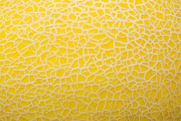 Macro melon peel texture,Close-up macro of yellow melon shell detail texture,Ripe sweet melon fruit texture background. Close up of a ripe fresh melon fruit pattern texture. 