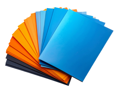 Angled Side View of Orange and Blue Flyers Spread in Fan Shape on Charcoal Surface, Isolated PNG