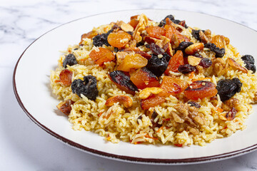 rice dish with dried fruits, nuts and spices of Middle Eastern cuisine, homemade, no people,