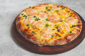 four cheese pizza with shrimp and fresh microgreens, served on a wooden board, homemade, no people,