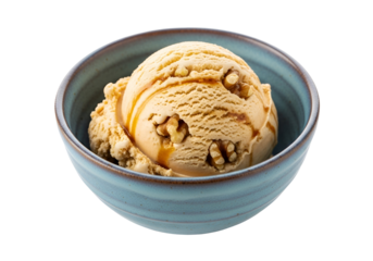 Creamy, caramel-drizzled ice cream scoop with walnuts in a light teal bowl against a black background.