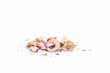 Colorful pencil shavings scattered isolated on white background with clipping path.