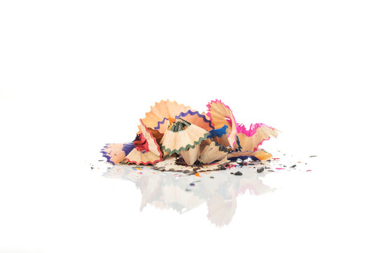Colorful pencil shavings pile isolated on white background with clipping path.