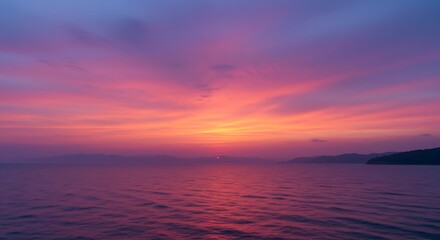 Fototapeta premium Sunset Over Calm Sea A Symphony of Pink and Purple Hues