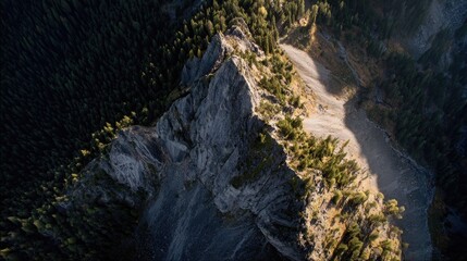 Mountain peak, aerial view, rocky face, forest