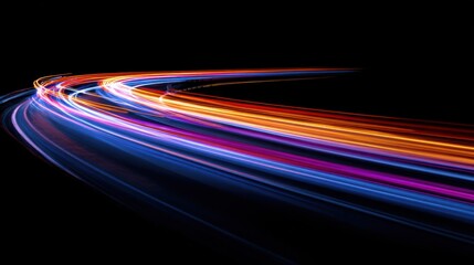 Vibrant streaks of colorful light trails curve across a dark background creating a sense of motion