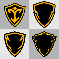 Obraz premium Four Stylish Black and Gold Shield Logos.ai