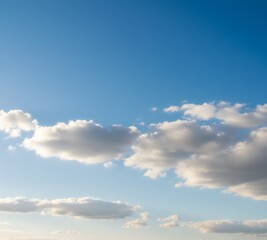 Fototapeta premium Clear Blue Sky with Soft Clouds