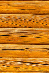 background in the form of a wall made of old wood. wood texture. wall made of old logs. natural wood background. aged logs. High quality photo
