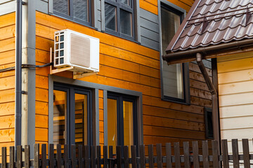 the external unit of the air conditioner attached to the facade of the house. air conditioner unit on the wall. air conditioning system for home