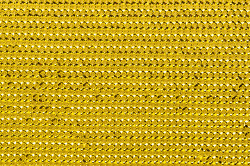 Golden sequins texture for background. Full depth of field.