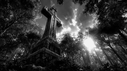 Tall cross standing in a dense forest under dramatic clouds