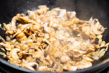 Sauteed Mushrooms with Onion and Garlic in Skillet