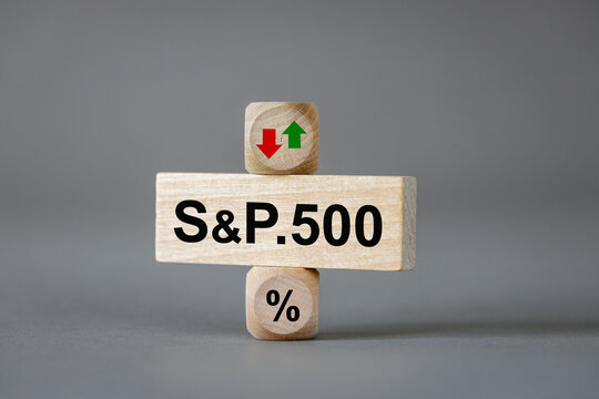 S and P 500 index symbol. Wooden blocks with an arrow that symbolizes a change in the S and P 500 index trend, either an increase or decrease. Business concept. copy space.