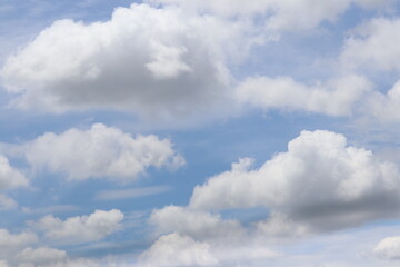 Sky of Dreams: A serene depiction of a bright sky, where fluffy clouds drift gently. The image...