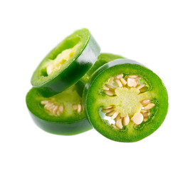 Fresh jalapeno pepper isolated on white background. Slices of green hot serrano pepper. Clipping path.