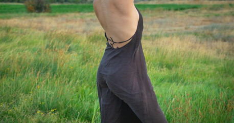 Young caucasian girl wearing summer dress in nature.
