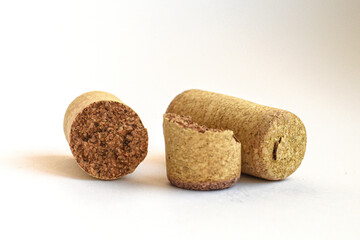 Mixed wine corks isolated. Assorted wine corks arranged on white surface, perfect for eco, drink, and rustic themes.