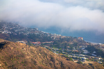 Marine layer rolling in over the Pacific Coast and Getty Villa, taken from Parker Mesa Overlook .