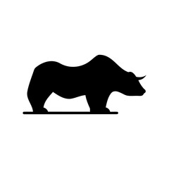 Silhouette of a large bovine animal standing on a flat surface