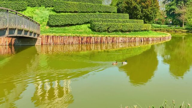 Parco Querini is green area of city of Vicenza, Italy. Monopteros is circular colonnade supporting roof but without any walls. Unlike tholos, it does not have walls making cella or room inside.