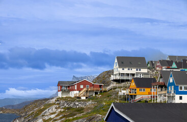 Panoramic view of Greenland capital Nuuk with colored houses located near fjords and icebergs