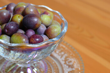A photograph of ripe olives taken indoors