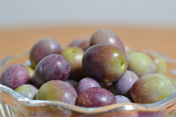 A photograph of ripe olives taken indoors