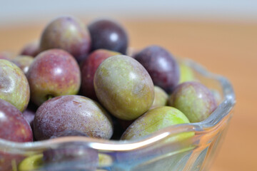 A photograph of ripe olives taken indoors