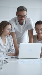 Obraz premium Business people team collaborating and analyzing data on a laptop during an office meeting, uniting efforts to reach shared objectives and drive successful outcomes together
