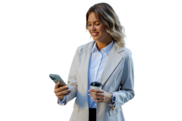 Businesswoman standing, smiling, holding smartphone and coffee cup, using mobile technology for communication and work