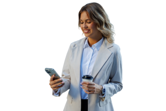 Businesswoman standing, smiling, holding smartphone and coffee cup, using mobile technology for communication and work - Powered by Adobe