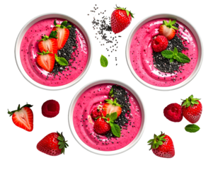 Three bowls of pink smoothie topped with berries and seeds