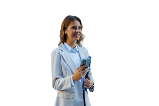 Young businesswoman wearing earbuds and holding smartphone, smiling and looking away, standing confidently - Powered by Adobe