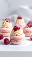Pink macarons with cream and raspberries on white surface