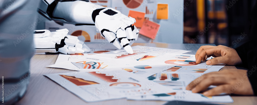 Poster a human and robot work together in a modern office, analyzing various charts and graphs, highlightin