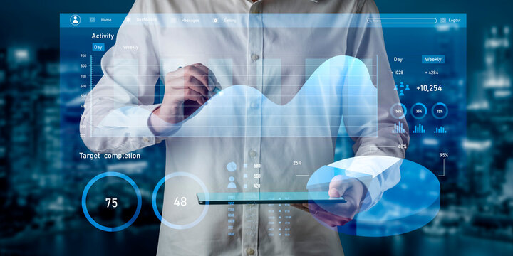 A professional analyzing data on a digital tablet, showcasing an abstract business analytics interface with modern visualization elements in an urban setting. Impute - Powered by Adobe