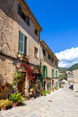 Valldemossa village on Mallorca island buildings with flowers portrait format in Spain