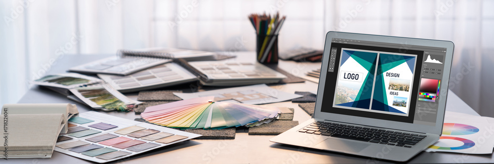 Poster graphic designer software for modern design of web page and commercial brisk ads showing on the comp