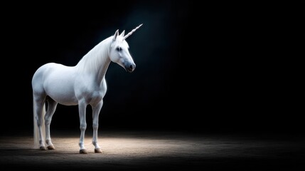 Majestic unicorn stands in a spotlight on a dark stage, creating an enchanting atmosphere