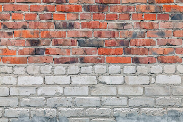 texture of old brick wall made of sand-lime and red brick as background
