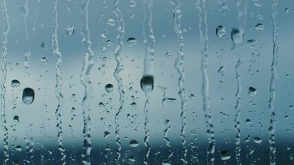 Dynamic CloseUp of Raindrops Streaming Down a Wet Window Pane on a Stormy Day. - Powered by Adobe