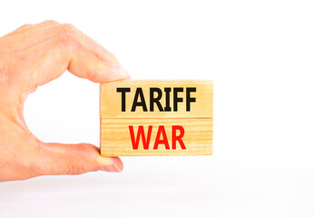 Trade tariff war symbol. Concept word Tariff war on beautiful wooden blocks. Beautiful white paper...