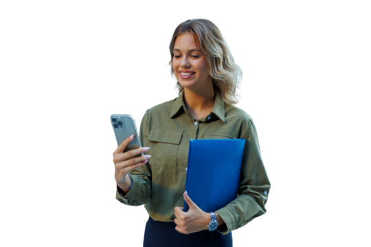 Young businesswoman standing, smiling and reading news on smartphone, holding document folder, communicating