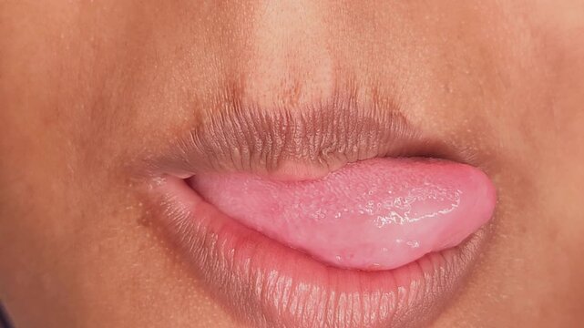 Attractive young girls lips and mouth, healthy skin face without makeup. Young woman face with sexy lips.