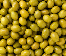Green olives close-up. Background of green olives.Top view.