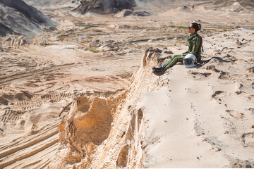 Female astronaut looking at desert horizon © karrastock