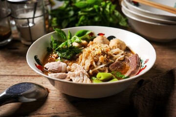 Noodle soup with sliced pork, pig blood, meatball and Thai morning glory,Nam Tok noodles