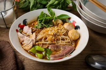 Noodle soup with sliced pork, pig blood, meatball and Thai morning glory,Nam Tok noodles
